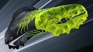 Modelo de tênis impresso em 3D nas cores cinza e verde limão. Continue lendo nosso post!